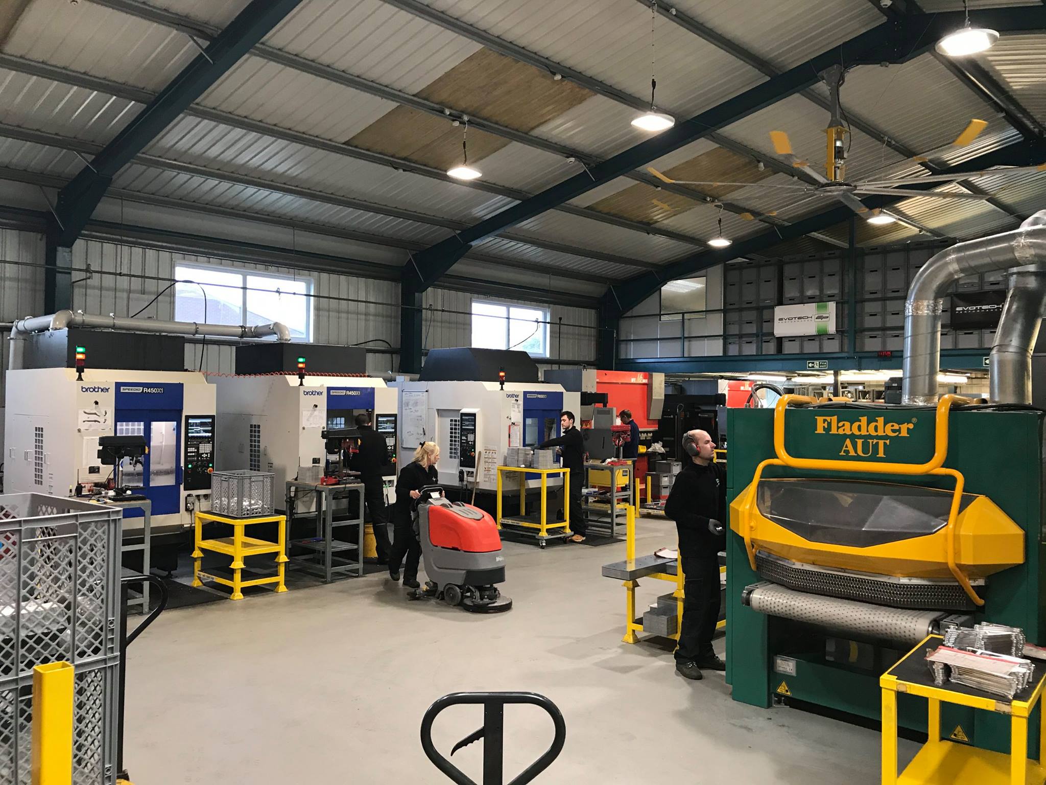 Three Milling Machines and a De-Burrer in the Foreground