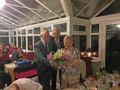 President Nigel Collins Presenting Jean Black With Flowers